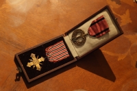 Military decorations awarded to witness' mother and father-in-law - Czechoslovak war cross 1939 - 1945 and Memorial medal of the Czechoslovak army in exile.
