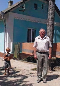 Jaroslav Moravec in front of a house where he was born, Velky Spakov, Ukraine, 2012 

