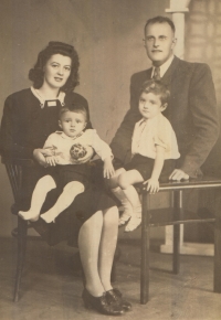 Family photo, mother, father, older brother, Jiří Prokop on the left on his mother's lap