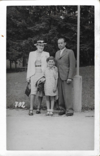 Marika with her parents.
