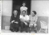 Marika with parents and grandmother.

