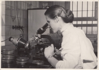 Věra Zikmundová while observing laboratory samples.