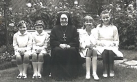 Twin sisters Anna and Božena on the left with a nun Vlastimila Pospíšilová; First Holy Communion, Bílá Voda, 16 August 1968