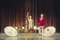 With her husband during a performance before 1989
