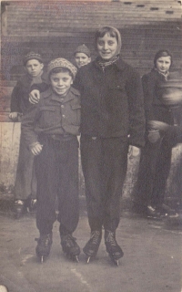 Ljuba, the witness, with her brother Jiří, whom she teaches to skate at the stadium in Štvanice, Prague, about 1954 