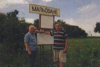 Brothers Jaroslav and Václav Loukota in front of their native village in Volhynia, 2014
