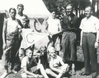 Martin Wels (holding the flag) at a summer camp