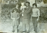 With his wife and daughters