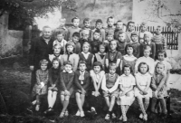 Křtěnov Elementary School - 1st and 2nd grade pupils (František is the fourth from the right from the teacher), 1962