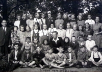 Witness´s father František Picek (in the middle) as a teacher in Slapy together with children that he tought. The headmaster of the school is on the left. They both were members of the local resistance group (year 1944)

