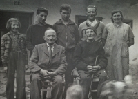 Marie (on the left) with her brothers and parents, Hugo Vaníček's father is sitting with a stick at the bottom, 1957