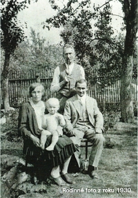 Family photo of Jaroslav sitting on his mother´s lap in 1930