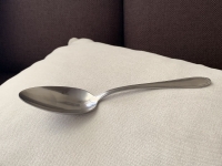 a large stainless steel spoon that Helene keeps as a reminder of World War II