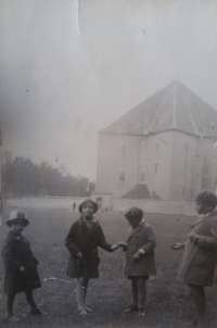 With her cousins at the Hvězda chateau. Věra, second from left. 1929