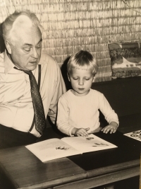 With his grandfather, as an approximately four years old child