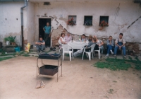The Kolář family back at their family farm. 1990
