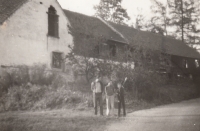 Rudolf Kolář and his sons in front of the family farm. Around 1982