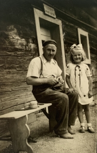Vlasta with father in front of the house