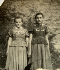 Mária (on the right) as a young girl with a her friend