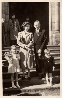With her parents, 1940s