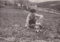 Background: Chotiměřice farm; forefront: witness’s brother Tomáš with dog Pepík that he was not allowed to take with him when expelled