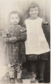 With her sister in childhood
