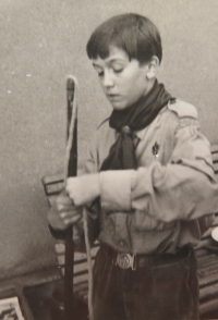 In a boy scout uniform