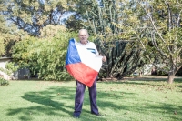 Pavel Peška in the garden of his house in Germiston, holding the Czechoslovak flag which he had torn off the flag pole in Wenceslas Square in August 1968. It is one of the few things he and Marie brought with them into emigration. Pavel still has it.