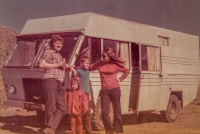 The Pechouš family in front of the van they made for their travels