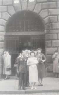 A wedding photo of Růžena Vavřichová and her husband in front of the Pilsen Town Hall, 1957