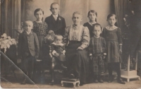 Her father Friedrich first from left standing with her mother Amália Kirchschlager, widow, mother of seven children, 1914

