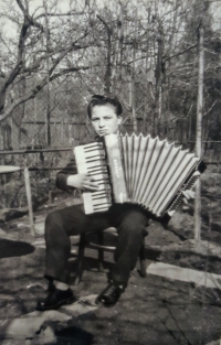 Playing harmonica in his youth