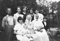The witness aged about six monts in her mother´s arms with her relatives and friends in 1934 