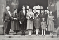 Wedding photo of Dana and Bohuslav Jirásek in front of the Old Town Hall in Prague- Bohuslav Jirásek's parents on the left (1959)