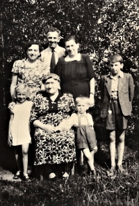 Three-year-old Ivan Zajíc (bottom right) with his mother's family. The photo shows his grandmother Marie Müllerová (bottom middle), his stepsister Dana next to her, his aunt Marie (top left), his father Ladislav (top middle), his mother Ivana (top second from the right) and his stepbrother Vladimír next to her.
