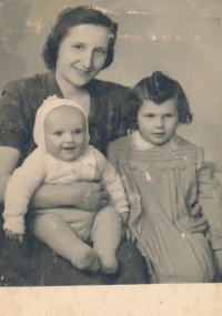 With her mother and younger brother, 1946