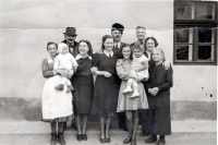 On the left, Samuel Roštár, the father of the witness's second wife, in front of his farm, which the Communists later demolished to build apartment buildings. Slovenská Lupča, 1944
From left, the maid of Márie's parents (Ema and Samul "Apík" Roštar Jr.), Delia (Márie's sister), Samuel Roštár (Márie's father, imprisoned in the 1950s for 2 years - unadaptable landowner and businessman - produced blueprints in Slovenská Lupča), Ema Roštárová (mother of Maria),?, Samuel Roštár Senior (refused to join the collective farm, imprisoned in Ilava at the age of 72 as a kulak for life), Delia Feldzam (Vilma's niece), Mária Roštárová, later witness's wife, Feldzam (Vilma's brother), Vilma "Aňuka" Roštárová (2nd wife of S. Roštárová) st.)

