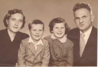With her brother and parents, 1953