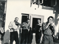 Her husband, Andrej Beňa (second from the left), yet unmarried, in Mokroluh 