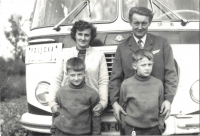 In front of a bus, Albín Blažek, his wife Marie and sons - Petr on the left, Milan on the right, Velehrad