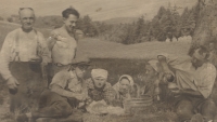 Jan Špičák with his children taking a snack while working in the fields, 1920s - 1930s 

