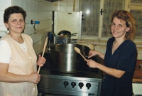 Marie Černohorská working at the pub with her daughter, 2008 


