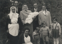 Baptism of Jan's sister Markéta.
Standing, from the left: dad's mother, Kateřina Hrušková; dad, Antonín; mom, Marie Pijáčková, née Kovářová; her brother Josef Kovář, the godfather, and his wife Božena Kovářová, godmother from the Kostníky village. Front row: dad's sister, Marie Pijáčková; cousin, Jana Kovářová; the witness; cousin, Marie Kovářová. Ostrožská Nová Ves.