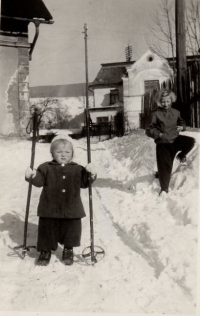 In winter in Rokytnice, Sister Ilona watching in the background, 1959
