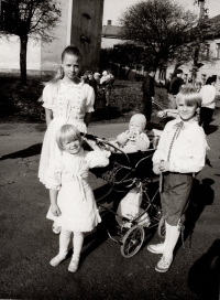 Children, the youngest Vasek in a pram, the older ones in costumes after performing in the children's dance group Vrabčáci, Vysoké, 1991 