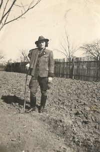 Hedvika in forrester's uniform in their family garden in Slovakia.  1942