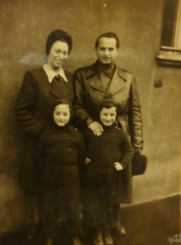 Photograph of parents and brothers after returning from Terezín, 1946.

