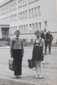 František Hron and his sister Marie Hronová in front of the school building