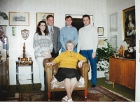 Hedvika Köhlerová sitting in an armchair, surrounded by all her grandchildren. 1994