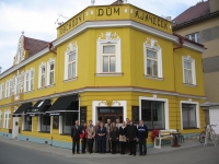 Pavel Janeček with his family and friends in front of the repaired house in Černovice (2013)